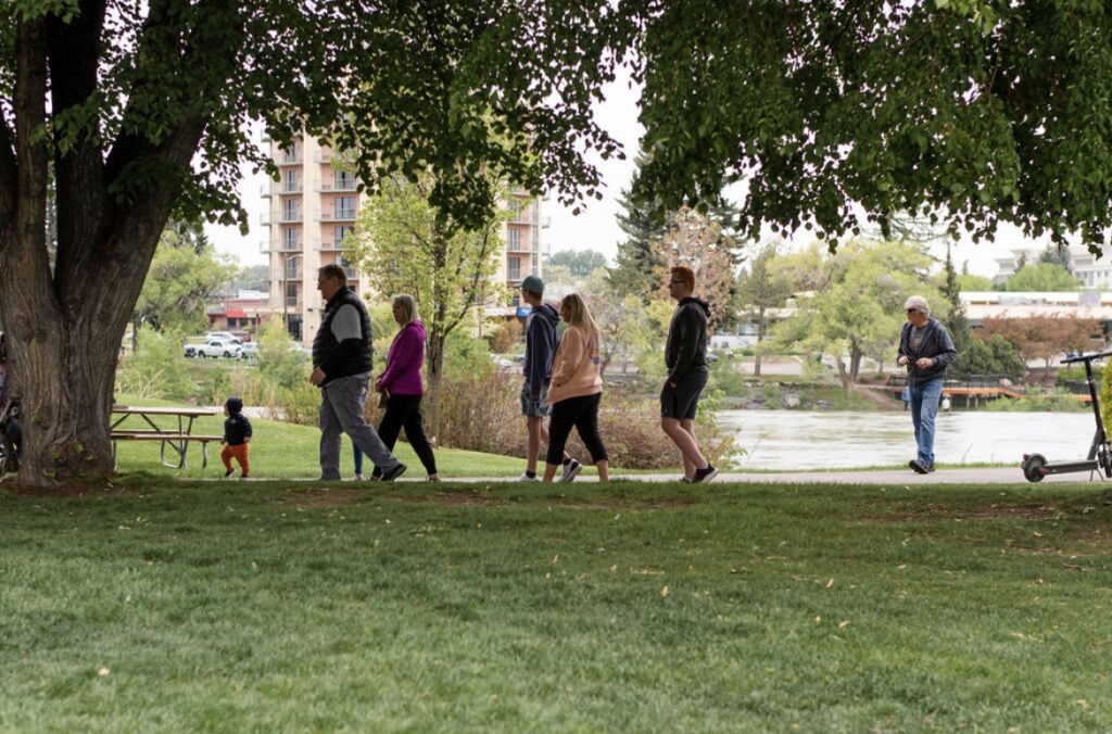 Family enjoying a walk around the Idaho Falls River Walk Greenbelt 